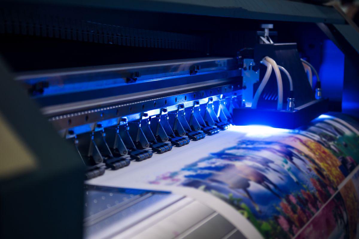 Close-up of inkjet printers in large machines.